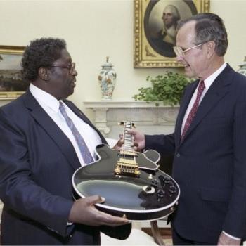 President Bush greets B.B. King who presents the President with a guitar