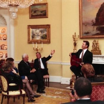 Country singer Larry Gatlin performs for President Bush and guests in the Yellow Oval Room