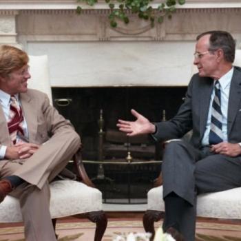 President Bush visits with Robert Redford in the Oval Office