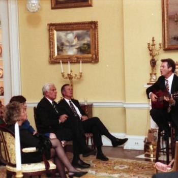 Country singer Larry Gatlin performs for President Bush and guests in the Yellow Oval Room