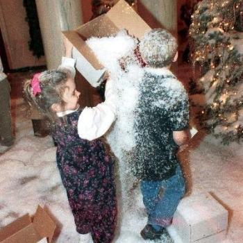 Grandchildren play in artificial snow