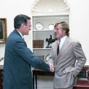 President Bush visits with Robert Redford in the Oval Office