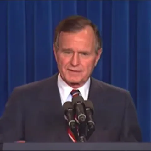 President Bush standing at a podium during a press conference