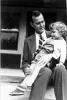 George Bush holds his daughter