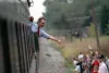 President Bush waves from the back of a train car during his campaign whistlestop in Bowling Green, OH.  26 Sep 92