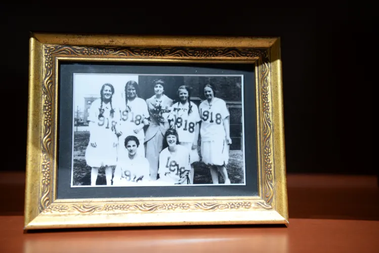One of the features of this exhibit is a bookcase full of framed family portraits. In the museum, you can take these off the shelf and read the captions on the back of each photo.