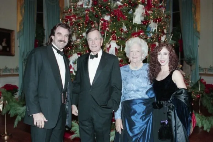 President and Mrs Bush pose for a photo with Tom Selleck and his Wife at reception of Kennedy Center honorees