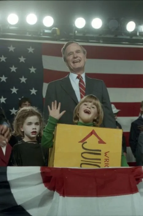 Vice President Bush's granddaughters, Barbara and Jenna, who are dressed in Halloween costumes, appear on stage with him at a campaign event in Kansas City, Missouri