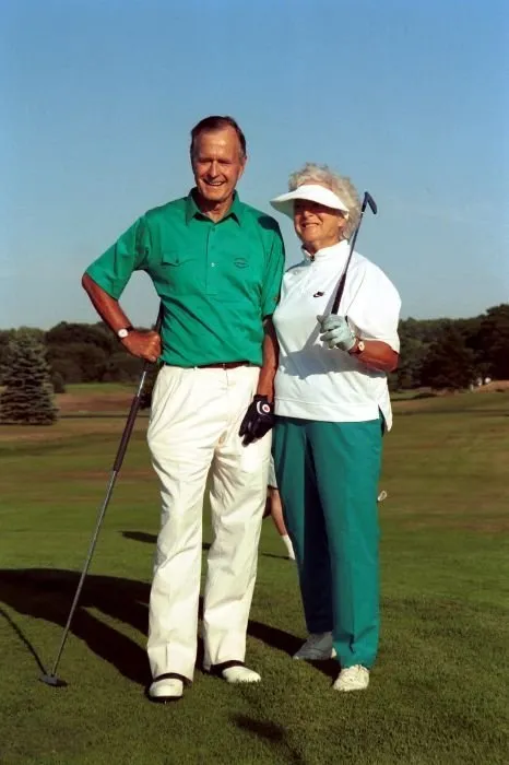 President Bush and Barbara Bush play golf at Kennebunkport