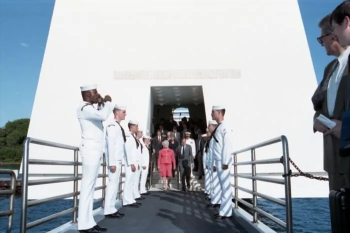 President and Mrs. Bush exit the USS Arizona Memorial after attending a ceremony there to commemorate the 50th anniversary of the Japanese attack on Pearl Harbor.