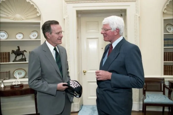 President Bush greets actor and spokesman for National Police Week, Peter Graves, in the Oval Office