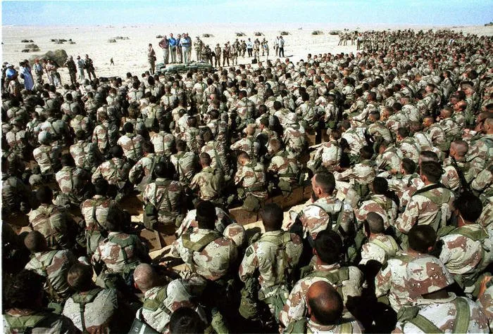 President Bush addresses the troops during a Thanksgiving visit to Saudi Arabia