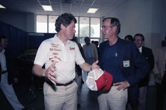 Vice President Bush visits with Arkansas Governor Bill Clinton at the Bass Anglers Tournament in Pine Bluff, Arkansas