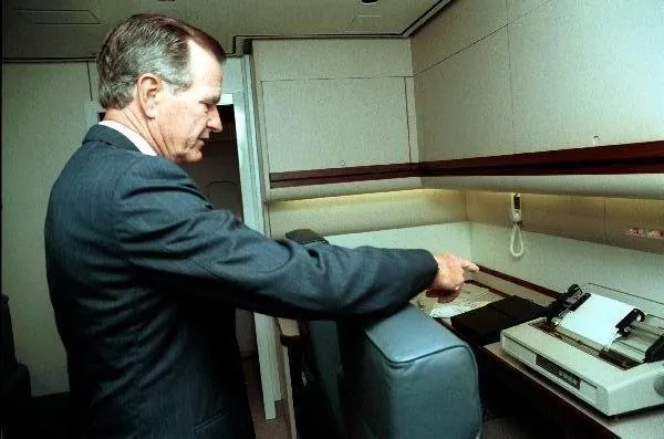 President Bush tours the new Air Force One while on the inaugural flight