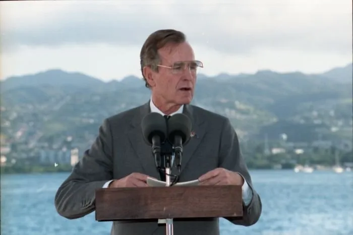 President Bush addresses the crowd at Pearl Harbor Naval Base Kilo 8 Pier during a ceremony commemorating the Japanese attack on Pearl Harbor and the start of World War Two.
