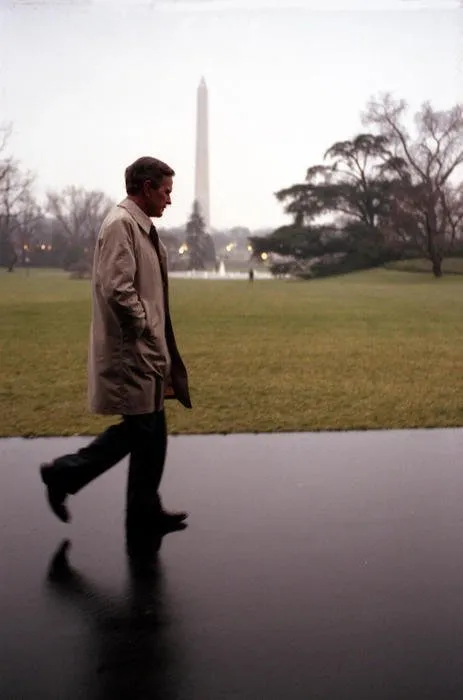 President Bush walks by himself on South Lawn