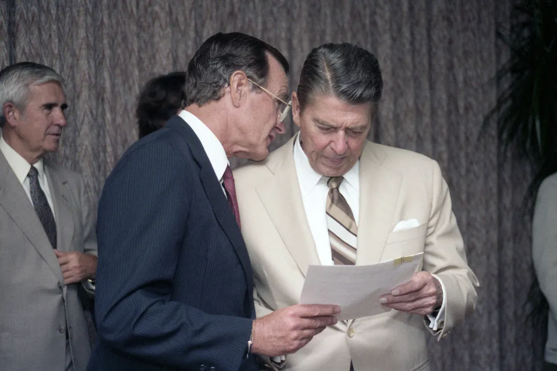 President Reagan and Vice President Bush go over campaign documents during the 1984 Republican National Convention in Dallas, Texas
