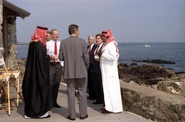 President Bush on patio at Walker's Point with Prince Saud, Baker, Sununu, Gates, and Haas
