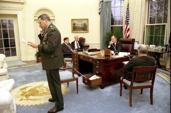 President Bush speaks by phone with PM Major, while Powell speaks on phone with Schwarzkopf