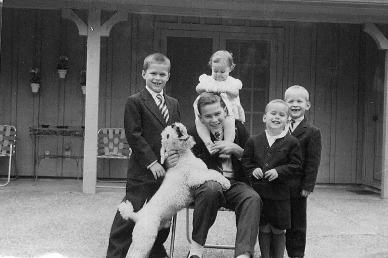 Jeb, George W. holding Doro, Marvin, Neil Bush with a white dog