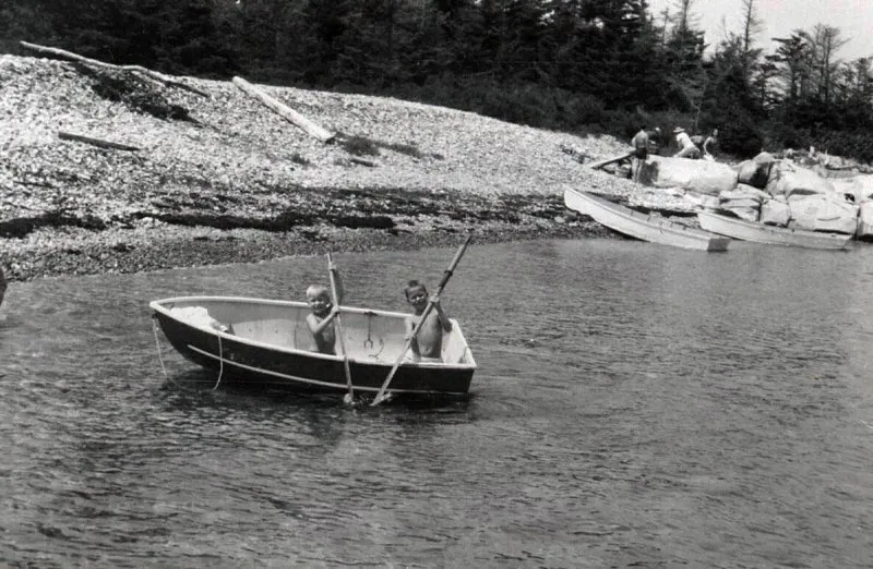 Neil and Jeb Bush in a boat with oars in Kennebunkport, Maine