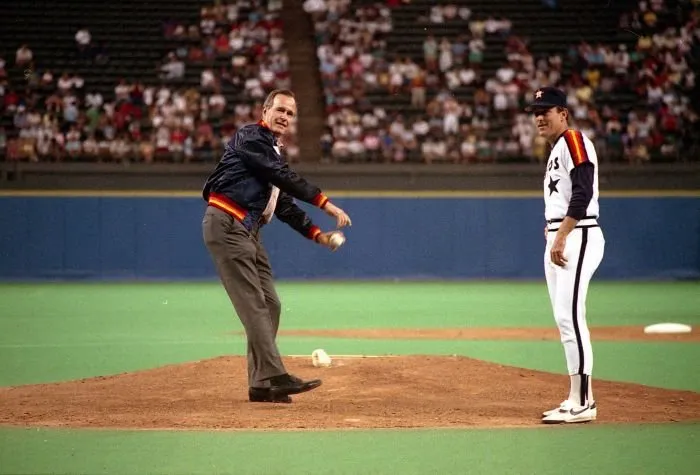Vice President George Bush throws out the first pitch at the Astrodome as Astro's pitcher Nolan Ryan looks on