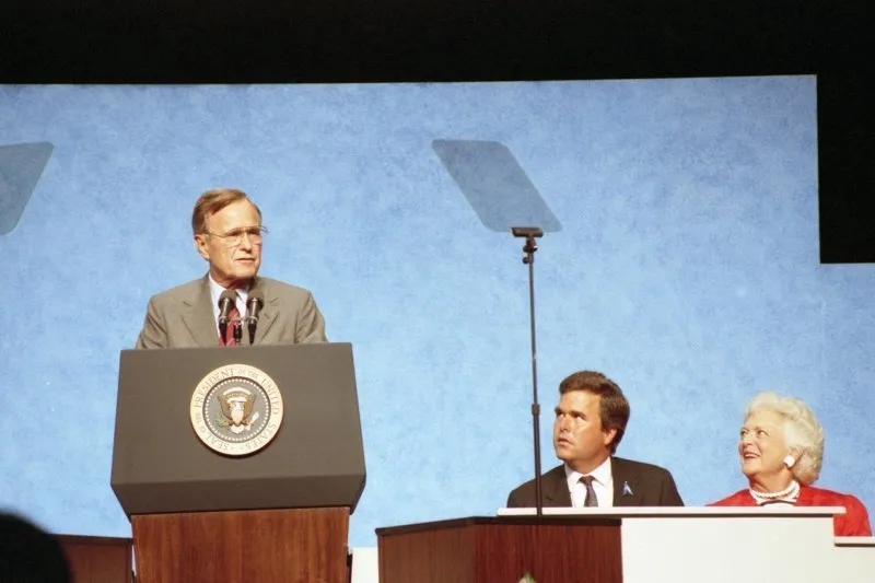 President Bush addresses the Beacon Council Annual Meeting, dias participants include Jeb and Bb
