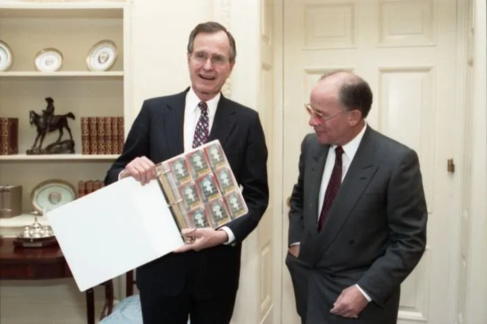 Arthur Shorin, President of Topps, presents President Bush with baseball cards