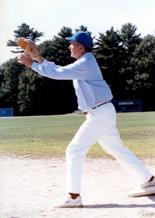 President Bush participates in a softball game with the press and staff in Kennebunkport, Maine