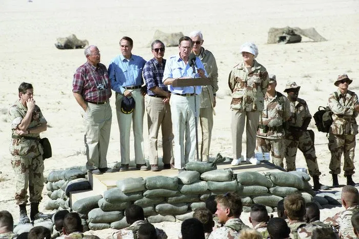 President and Mrs. Bush visit troops from the U.S. Army’s 197th Brigade in Saudi Arabia, and have Thanksgiving Dinner with them
