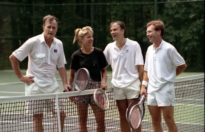 President Bush plays doubles tennis with Chris Evert, David Bates, and Tut Bartzen