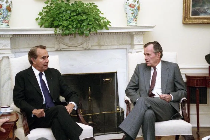 President Bush meets with Senator Bob Dole in the Oval Office
