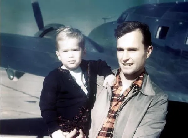 George Bush Holds Up his Son, George W.
