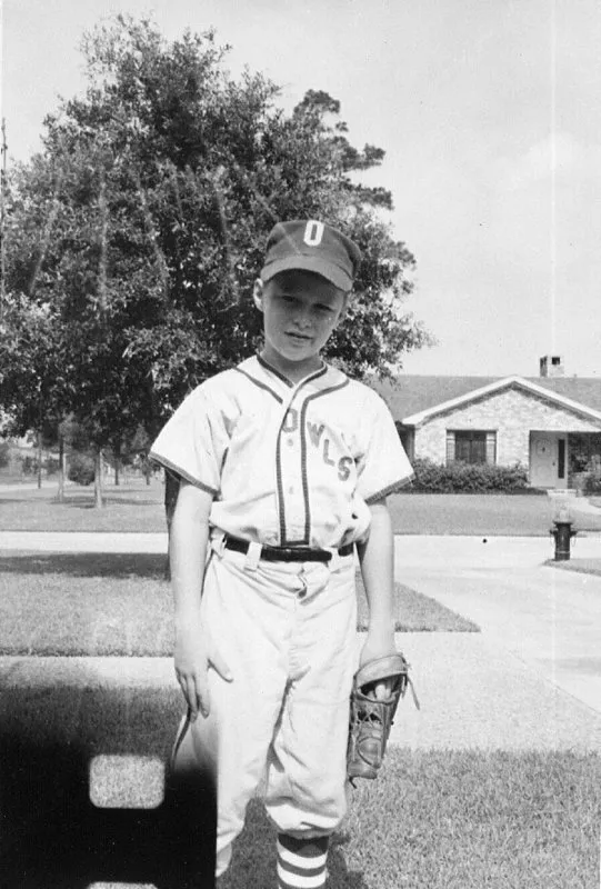 Jeb Bush in an Owls baseball uniform with a baseball glove