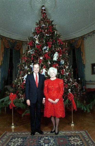 President Bush and Barbara Bush in front of White House Tree