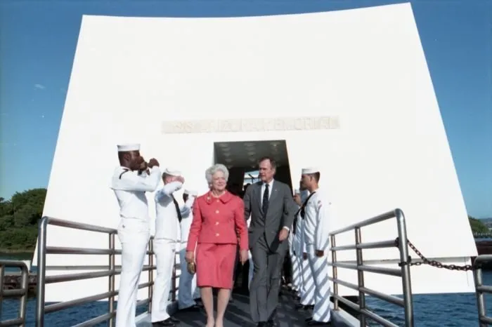 President and Mrs. Bush exit the USS Arizona Memorial after attending a ceremony there to commemorate the 50th anniversary of the Japanese attack on Pearl Harbor.
