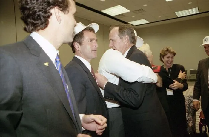 Vice President Bush hugs Jeb bush and celebrates electon results with friends