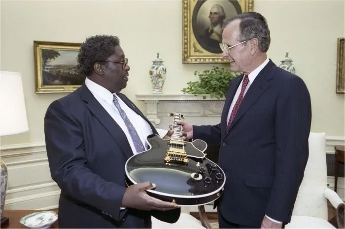 President Bush greets B.B. King who presents the President with a guitar
