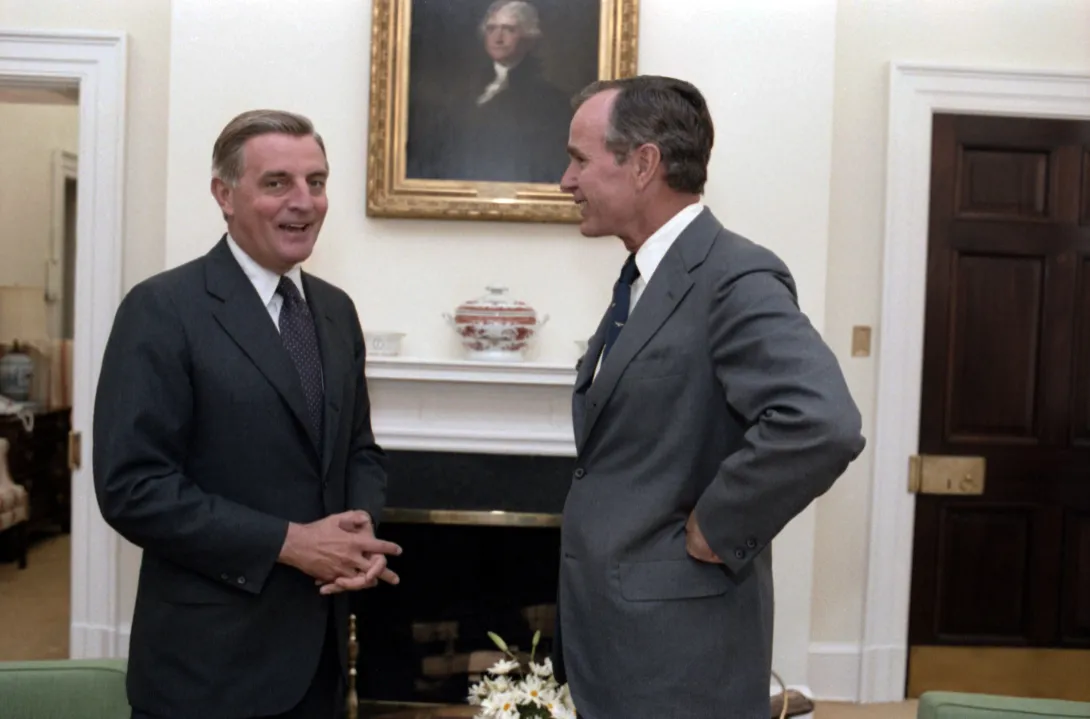Vice President Bush meets with former Vice President Walter Mondale in the Vice President's West Wing Office at the White House