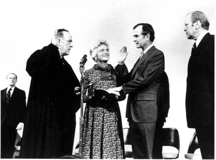 George Bush is sworn in as Director of CIA by Justice Potter Stewart as President Ford looks on