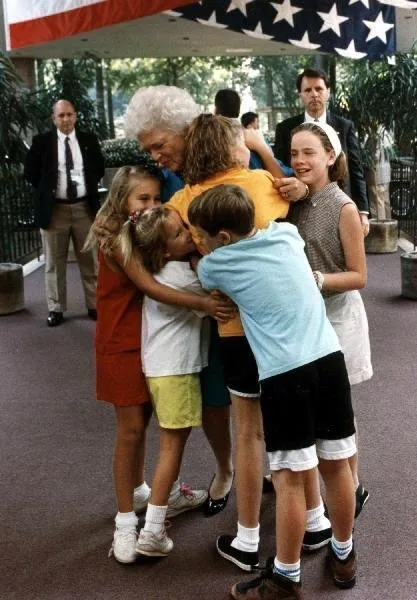 Mrs Bush hugs her grandchildren upon arrival at the Houstonian Hotel