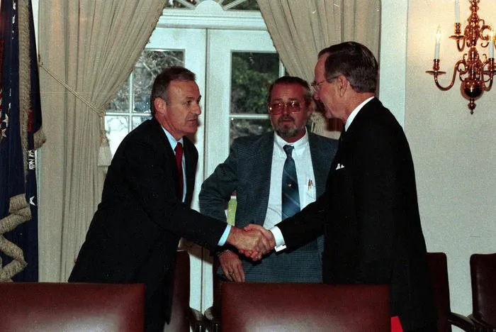 President Bush meets with released hostages, who were held in Kuwait by Iraq.
