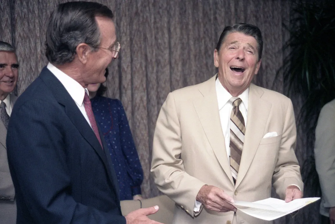 President Reagan and Vice President Bush go over campaign documents during the 1984 Republican National Convention in Dallas, Texas