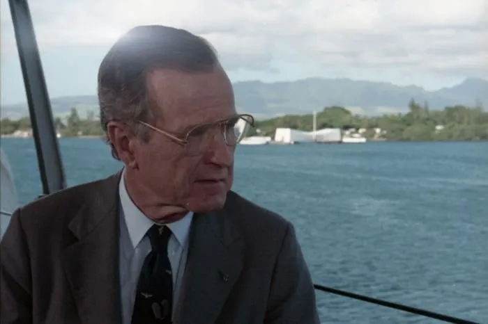 President Bush participates in a television taping session aboard the USS Missouri on the 50th anniversary of the Japanese attack on Pearl Harbor.