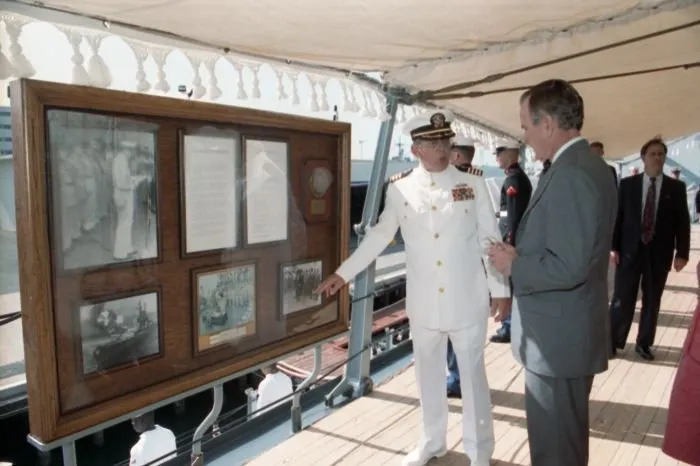 President Bush and Mrs. Bush receive a tour of the USS Missouri from Captain Albert Lee Kaiss on the 50th anniversary of the Japanese attack on Pearl Harbor.