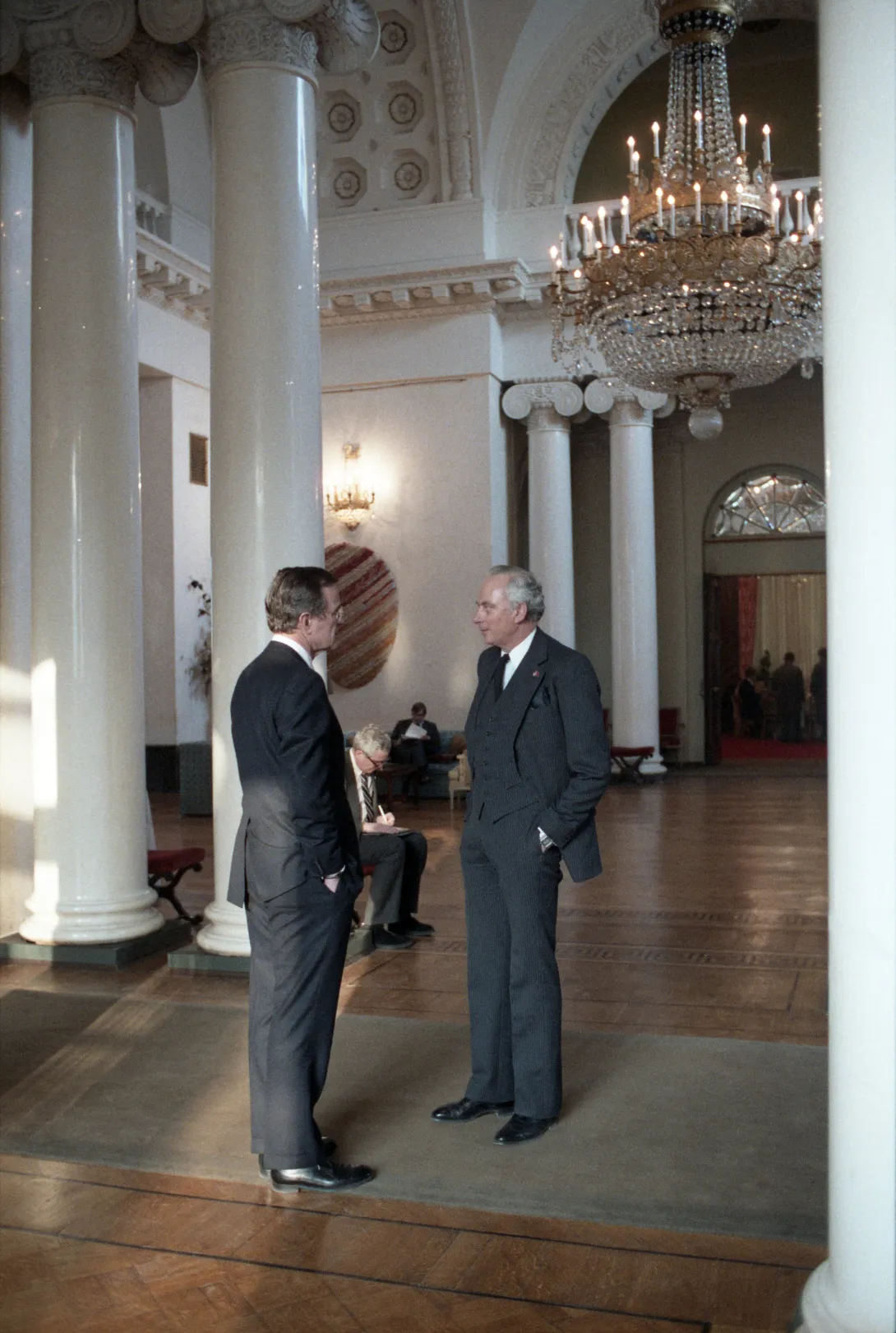 Vice President Bush speaks to U.S. Ambassador to the Soviet Union Arthur A. Hartman at the U.S. Embassy, during his trip to Moscow for the Funeral of the Chairman the Chairman of the Presidium of the Supreme Soviet of the Soviet Union, Yuri Andropov in...