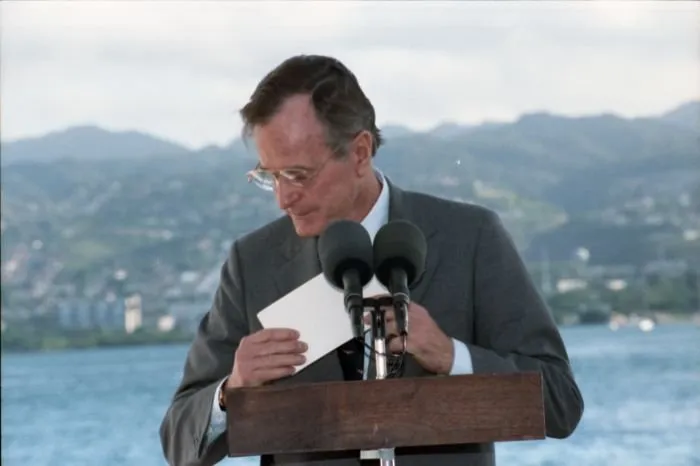 President Bush addresses the crowd at Pearl Harbor Naval Base Kilo 8 Pier during a ceremony commemorating the Japanese attack on Pearl Harbor and the start of World War Two.
