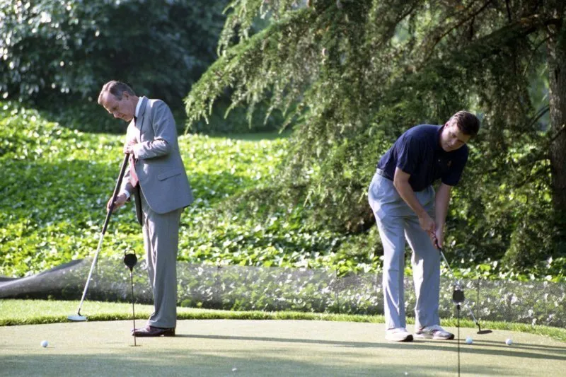 President Bush with Jeb on the White House Putting Green