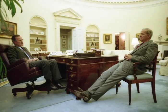 President Bush meets with James Baker in the Oval Office before debate rehearsal