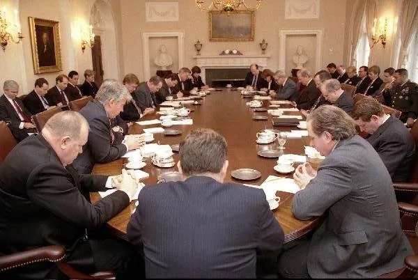 President Bush and the Cabinet pray during their meeting regarding Operation Desert Storm